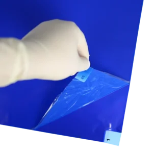 Adhesive Mats - peeling back layers of blue mat to reveal second layer